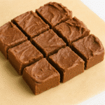 Keto Cottage Cheese Fudge – The Low-Carb Treat You’ll Love 5 Keto cottage cheese fudge squares arranged in a grid on parchment paper