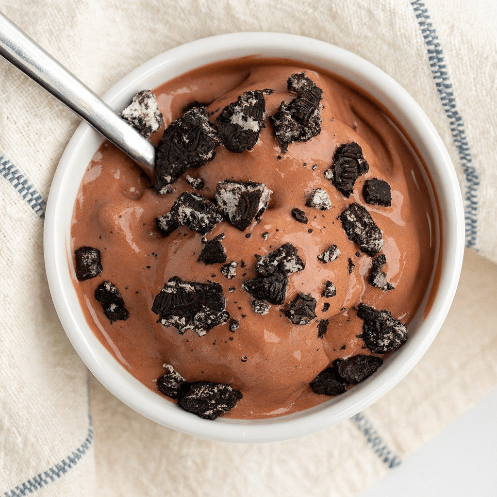 Ninja Creami Cottage Cheese Ice Cream (Better Than Store-Bought!) 9 Rich and creamy chocolate cottage cheese ice cream made in a Ninja Creami, topped with crushed chocolate cookies in a white bowl